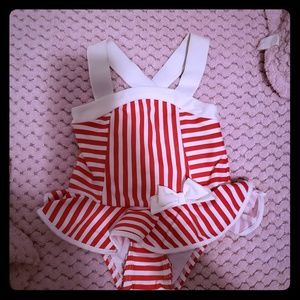 Striped bathing suit for baby girl.